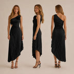 A black one-shoulder pleated midi dress is shown on a model from three angles: front, side, and back. The dress features a single floral embellishment on the shoulder, a side cutout, and a gathered, pleated skirt with an asymmetrical hem.
