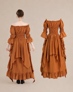 A model is shown from the back wearing a rust-brown off-the-shoulder maxi dress with layered ruffles, paired with black boots. A second view of the same dress is shown to the right against a solid beige background.